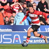 Doncaster's Luke Molyneux gets on the ball in Tuesday's win over Sheffield Wednesday.