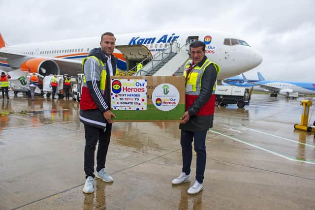 Charity Masks for Heroes ambassadors Callum Best and Tamer Hassan unload a shipment of PPE from a Boeing 767 at Doncaster's Robin Hood Airport.