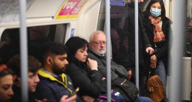 A woman on the Jubilee line of the London Underground tube network wearing a protective facemask on the day that Health Secretary Matt Hancock said that the number of people diagnosed with coronavirus in the UK has risen to 51. Victoria Jones/ PA Wire Copyright: PA (Press Association)