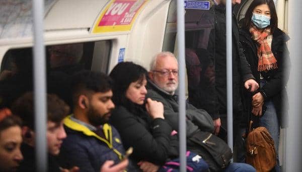 A woman on the Jubilee line of the London Underground tube network wearing a protective facemask on the day that Health Secretary Matt Hancock said that the number of people diagnosed with coronavirus in the UK has risen to 51. Victoria Jones/ PA Wire Copyright: PA (Press Association)