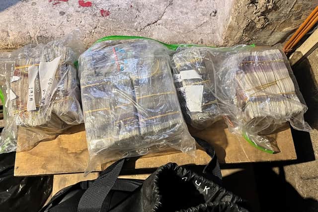 Police seized £100,000 in cash in the raid in Doncaster city centre.