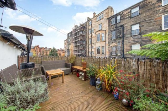 Accessed via the lounge area, the property’s private terrace provides plenty of space for entertaining in good weather, and for budding gardeners