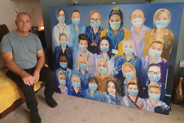 Artist Mark Kelsall with his painting of nurses at Cusworth ward, at Tickhill Road Hospital, Balby, Doncaster