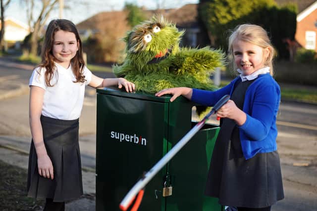 Southfield Primary's Millie Wareham, eight, and Mackenzie Malton, seven, pictured with Bitter the Litter Critter. Picture: NDFP-18-01-22-SuperBin 2-NMSY