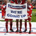 Rovers goalscorers Francis Tierney, Dave Morley and Paul Green celebrate promotion to the Football League