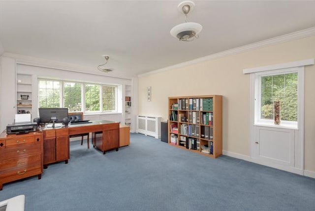 This is a large office space that could probably be turned into anything. Gym, games room, another bedroom, another kitchen. Anything.