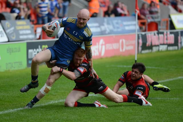 Dons winger Tom Halliday is bundled into touch by Richard Wilkinson of London Skolars. Photo: Rob Terrace