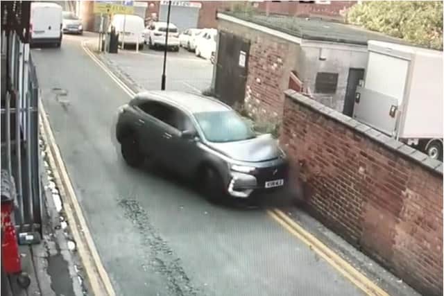 The moment a hapless driver slammed into a brick wall in Doncaster town centre.
