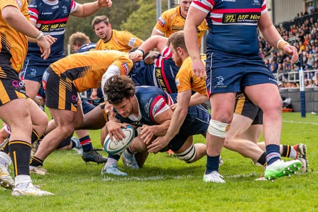 Archie Smeaton dives over the line