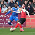 Cheltenham Town's Alfie May fires in his second against Doncaster Rovers.