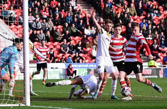 Picture Howard Roe/AHPIX LTD; Football, SkyBet; League Two;
Doncaster Rovers v Newport County ;
1/3/2025 3.00 pm; Eco-Power Stadium;
Doncasters' Rob Street slots home the opening goal