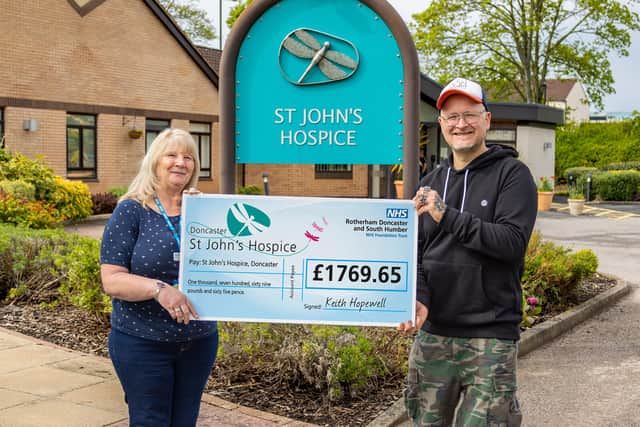 Keith and mum Linda with the cheque at St John’s Hospice