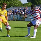 Doncaster's Kieran Agard crosses the ball against Nuneaton. Photo: Andrew Roe/AHPIX LTD.