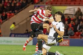 Joe Ironside has his effort blocked by Salford's Ossama Ashley.