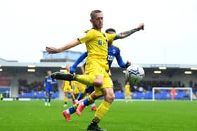 Charlie Lakin of Burton Albion crosses the ball during the Sky Bet League One match between AFC Wimbledon and Burton Albion at Plough Lane on October 02, 2021 in Wimbledon, England. (Photo by Alex Davidson/Getty Images)