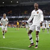Marcus Rashford of Manchester United celebrates after scoring a goal, which is later disallowed following a Handball decision via a VAR Review, during the Premier League match between Wolverhampton Wanderers and Manchester United at Molineux on December 31, 2022 in Wolverhampton, England. (Photo by Naomi Baker/Getty Images)