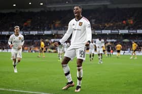 Marcus Rashford of Manchester United celebrates after scoring a goal, which is later disallowed following a Handball decision via a VAR Review, during the Premier League match between Wolverhampton Wanderers and Manchester United at Molineux on December 31, 2022 in Wolverhampton, England. (Photo by Naomi Baker/Getty Images)