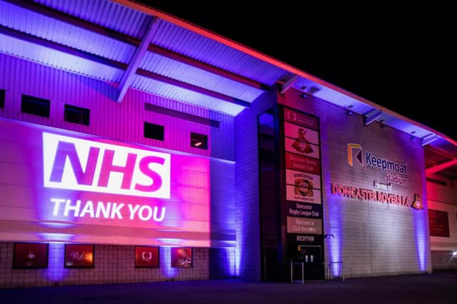 The Keepmoat Stadium lit up in honour of the NHS