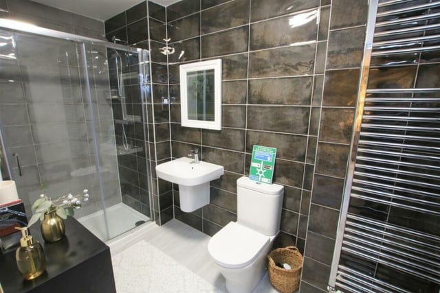 A tiled and contemporary style shower room.