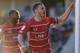 Tommy Rowe celebrates his equaliser against AFC Wimbledon. Photo: Martin Smith/AHPIX LTD