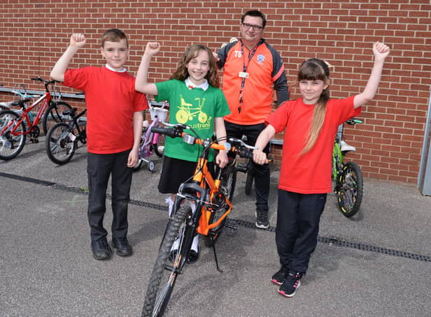 Terry Storey, LSA and Academy Bike It Ambassador, Tucker Watson, ten, Chloe Worth, ten and Amy Rose, ten, Bike It Crew members, celebrate coming 1st across Yorkshire and the Humber region. Picture: NDFP-18-05-21-SheepDipBike 2-NMSY