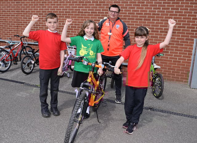Terry Storey, LSA and Academy Bike It Ambassador, Tucker Watson, ten, Chloe Worth, ten and Amy Rose, ten, Bike It Crew members, celebrate coming 1st across Yorkshire and the Humber region. Picture: NDFP-18-05-21-SheepDipBike 2-NMSY