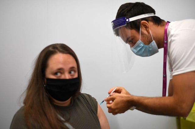 A member of the public receives a Covid-19 vaccine
