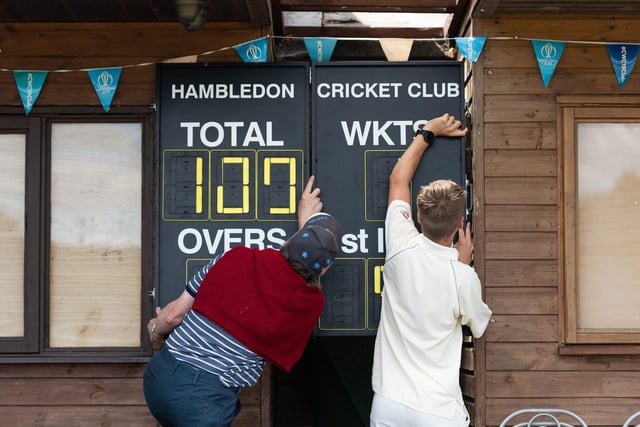 The scoreboard being operated by hand at Hambledon Cricket Club as they return to action at Ridge Meadow. Picture: Jordan Pettitt/Solent News & Photo Agency