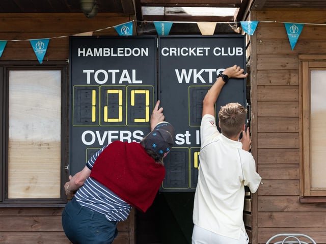 The scoreboard being operated by hand at Hambledon Cricket Club as they return to action at Ridge Meadow. Picture: Jordan Pettitt/Solent News & Photo Agency