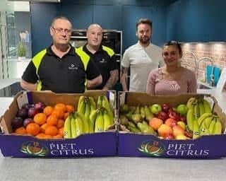 Staff are provided with free fruit - (from left) Kevin Pugh, Richard Clark, Curtis Shearer and Giorgia Fortunato