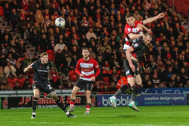 GOAL: Owen Bailey heads Doncaster Rovers in front