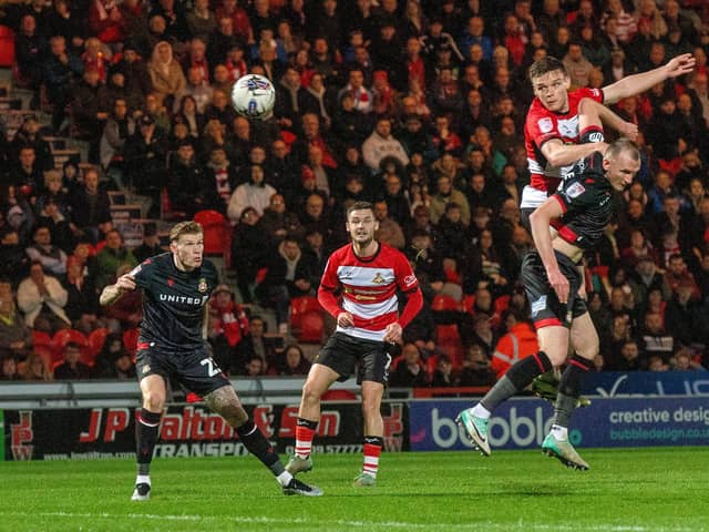 GOAL: Owen Bailey heads Doncaster Rovers in front