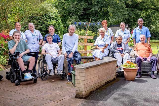 Patients and colleagues in the garden at Magnolia Lodge.