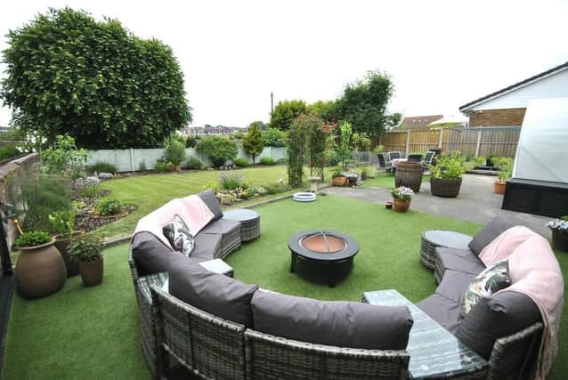 The lawned and landscaped garden of the property is ideal for sitting out or entertaining.