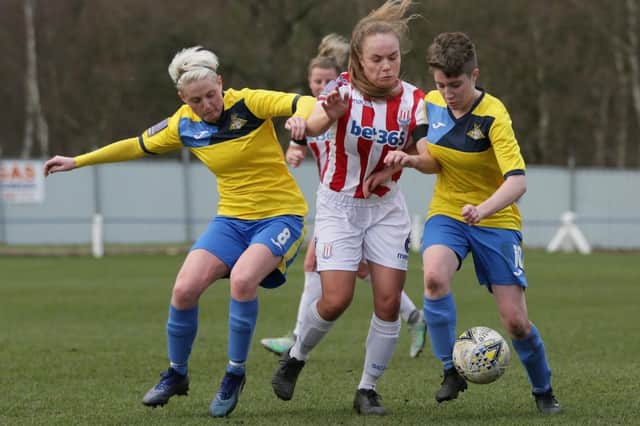 Kirsty Smith and Abby Watkinson battle for possession. Photo: Julian Barker