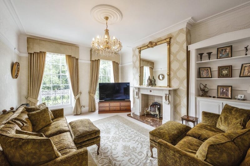 One of two light and spacious reception rooms with feature fireplaces.