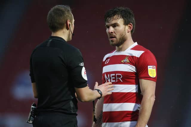 Andy Butler shares a word with referee James Bell. Picture: Ed Sykes/AHPIX