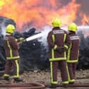 Residents are being warned to keep their windows and doors closed after a serious fire broke out in South Yorkshire. File picture shows South Yorkshire firefighters