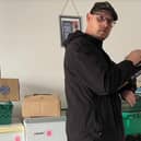 Paul, a volunteer at the Cambeth Community Project stocktaking after a fresh delivery to the Community Fridge in Doncaster.