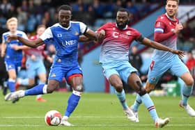 Joe Dodoo fires on goal against Scunthorpe in the FA Cup. Picture: Andrew Roe/AHPIX