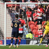 Doncaster Rovers defender Tom Anderson wins a header in the second half against Swindon Town.