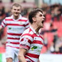 Harrison Biggins celebrates his goal.
