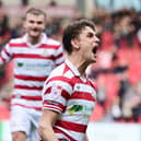 Harrison Biggins celebrates his goal.