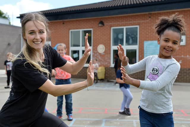 Royal Ballet dancer and Doncaster local Charlotte Tonkinson and David Pickering from The Royal Opera House lead a creative ballet workshop for the school children Southfield Primary School. Year 1 pupil Annie Watts with Charlotte.