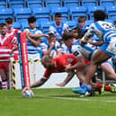 Dons Luke Briscoe scores their second try in defeat at Halifax.
