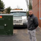 Jon-Paul Chambers, Owner at Footprint Builders, pictured by the Fibre Optic Broadband Box, which has been built across the entrance to car parking meant to serve eight properties on West Road, in Moorends. Picture: NDFP-26-01-21-BroadbandBox 2-NMSY