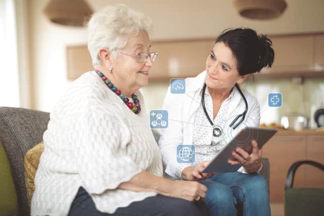 Social worker visiting an elderly woman. Credit: Tunstall Healthcare