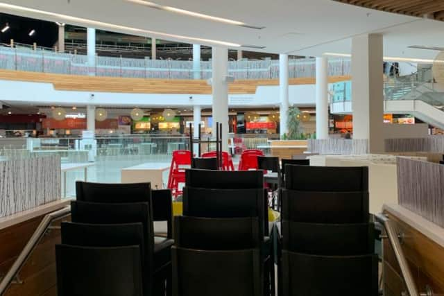 Stacked chairs at Meadowhall's Oasis Dining Quarter, which remains open for takeaways only