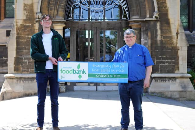 John Parr, Doncaster's Trussell Trust Food Bank Project Manager, pictured with Revd Capt Chris McCarthy, Vicar at St James Church. Picture: NDFP-08-06-21-StJamesFoodbank 2-NMSY