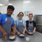 Left to Right - Vhon Prin, Molly Green, Chloe Colton from Communication Specialist College Doncaster taking part in the GUINNESS WORLD RECORDS™ cooking lesson attempt